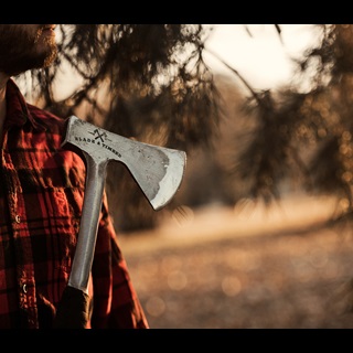 Blade and Timber - Man holding axe outside