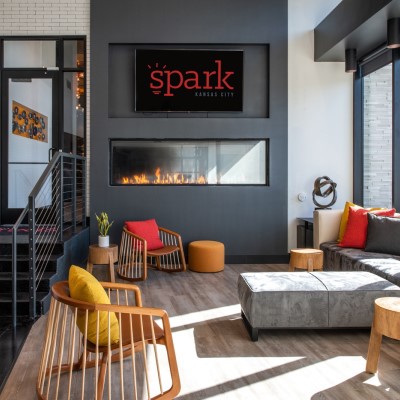 Spark Coworking Kansas City Lounge Space with Fireplace and Comfortable Seating